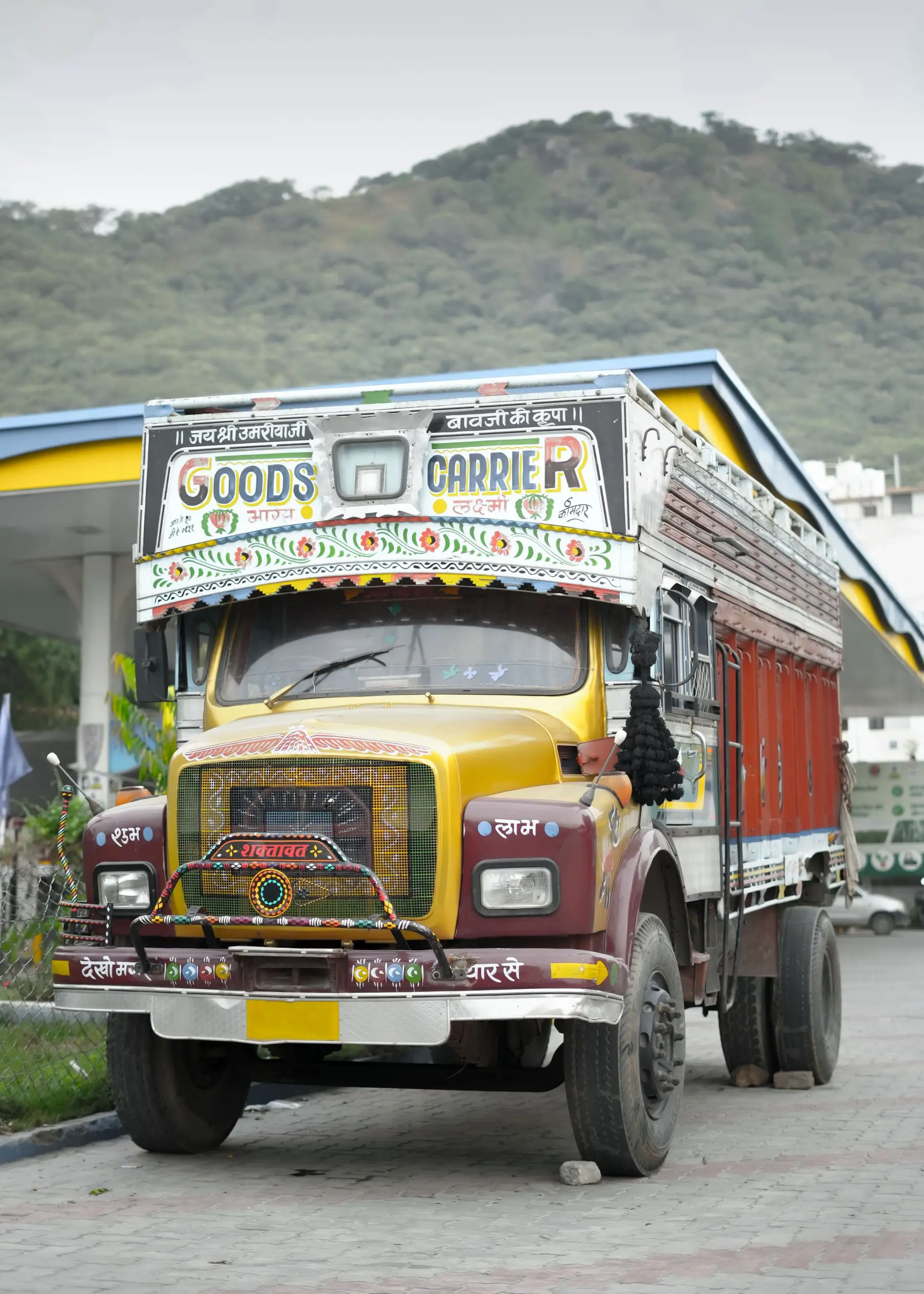 A hand-painted Indian goods carrier truck, the kind of vehicle booked for business consignments